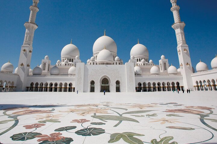 Experience the stunning architecture of Sheikh Zayed Grand Mosque where intricate designs meet serene surroundings a highlight of your private Abu Dhabi tour. Perfect for cultural explorers.